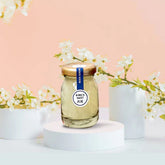 Rock Sugar Lifestyle Enriched Bird’s Nest in a glass jar with floral background.